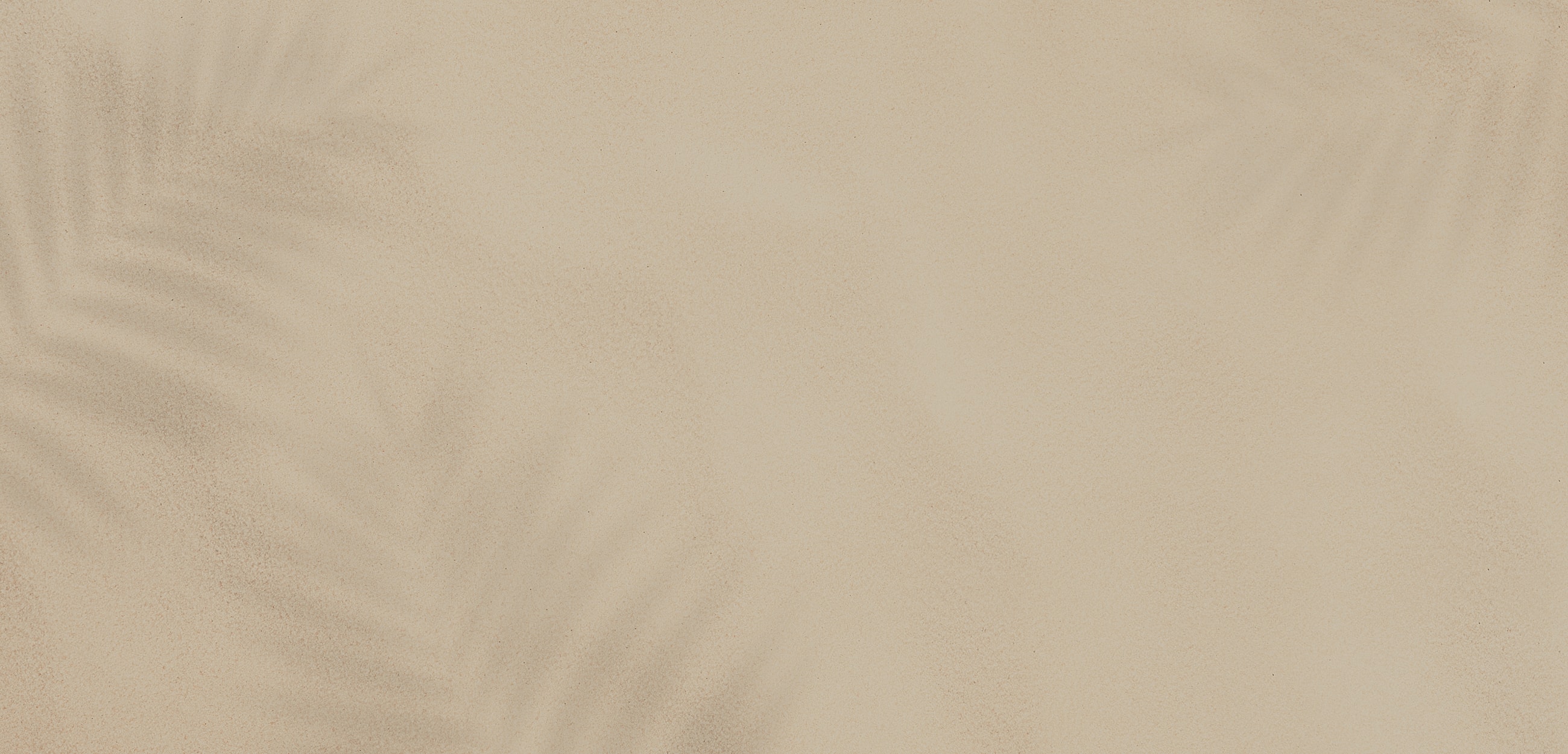 Light beige surface with subtle shadow patterns.