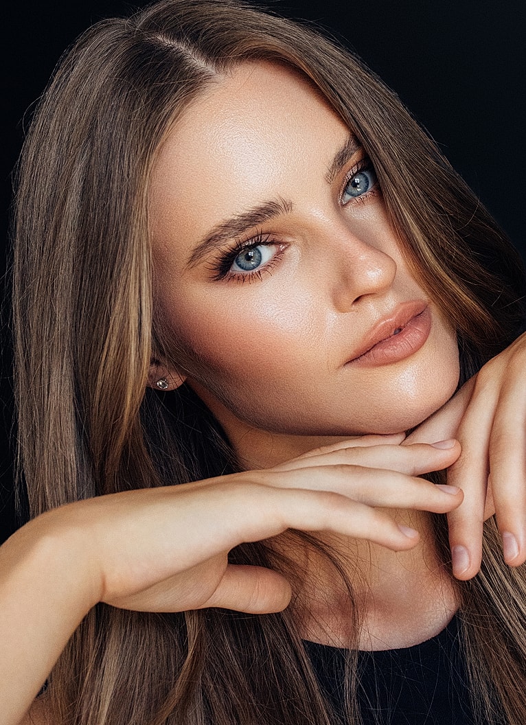 Close-up portrait of a Melbourne facial cosmetic surgery model with captivating eyes.