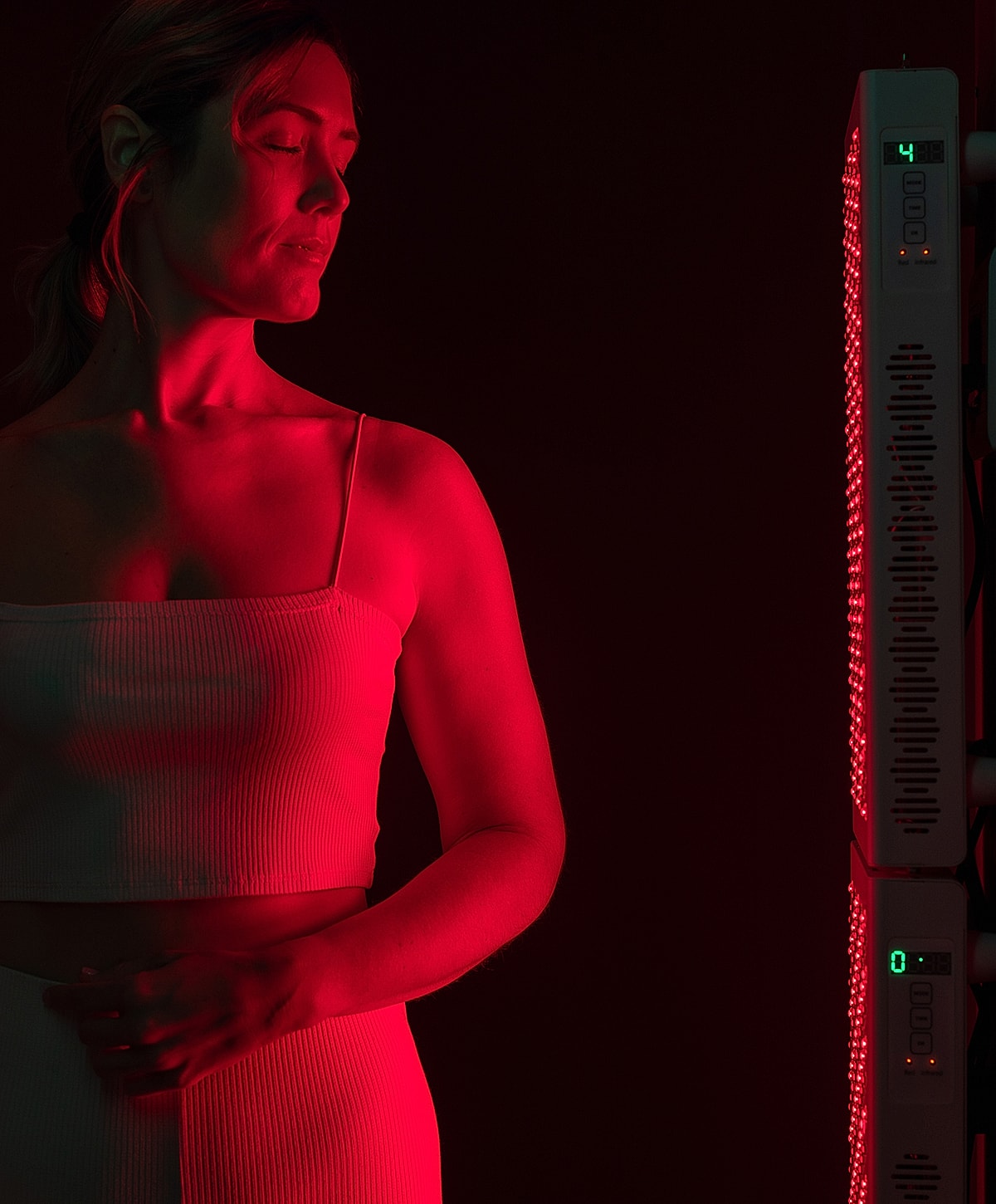 Melbourne red light therapy model next to a red light therapy device.