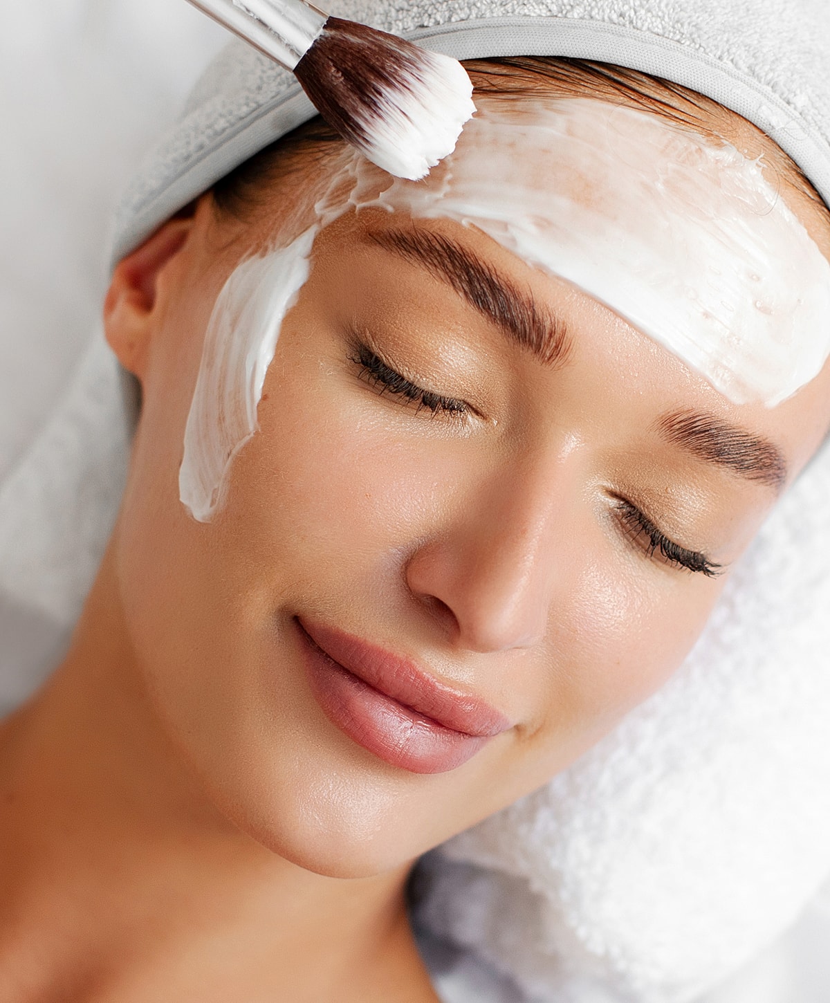 Melbourne facial model receiving facial treatment in spa setting